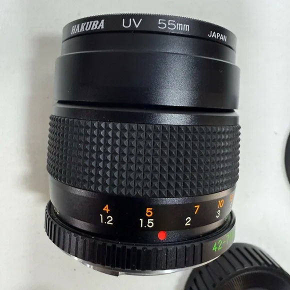 Yashica Zoom Lens 42- 75mm with case & Hakuba uv 55mm lens